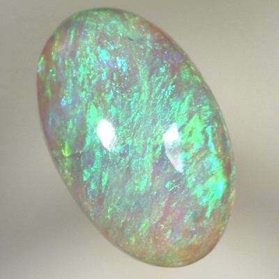 SOLID CRYSTAL OPAL Bright green fire in a 3 dimensional pattern